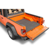 https://www.quadratec.com/sites/default/files/styles/product_teaser/public/product_images/BED-Classic-Bed-Mat-jt-installed-rear-angle-driver.jpg